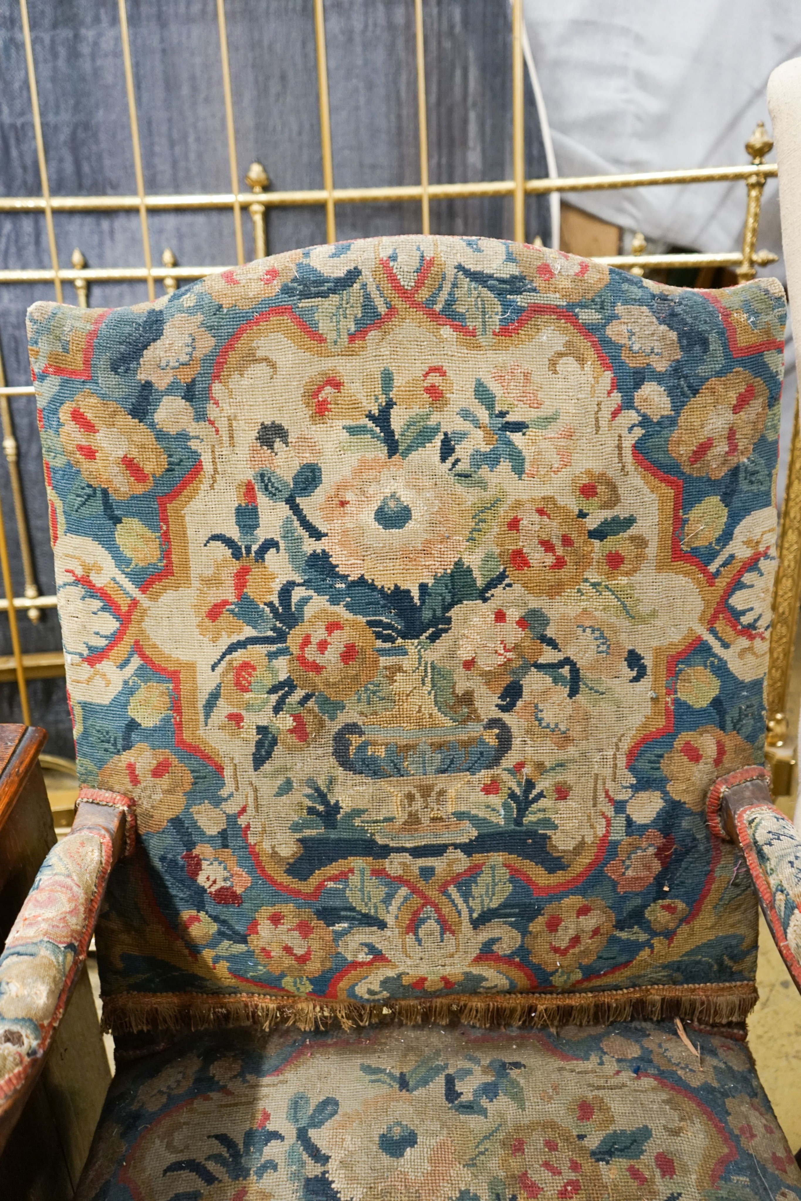 An 18th century French carved walnut elbow chair with tapestry upholstery, width 60cm, depth 58cm, height 104cm